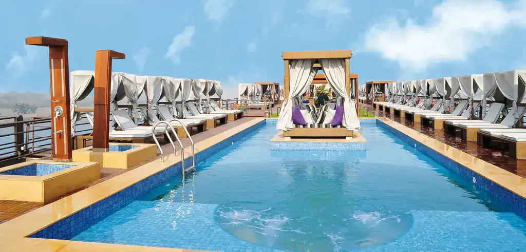 Sun deck pool with loungers and cabanas aboard the M/S City & Sea Adonis