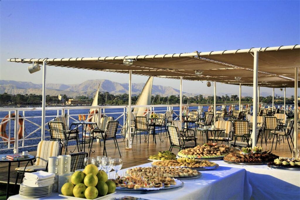 Sun deck buffet with fresh fruit and appetizers aboard the M/S City & Sea Adonis, Nile River view.