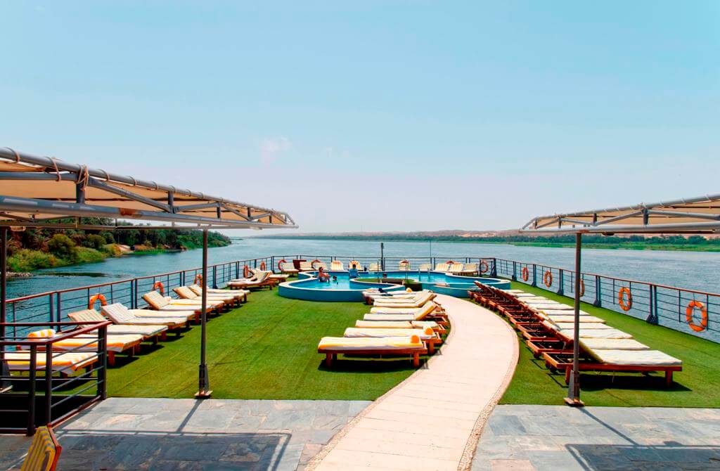 Sun deck aboard the M/S City & Sea Adonis with pool, loungers and Nile River views.